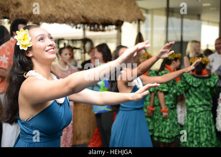 Traditional Hawaiian hulu dancers entertain guests waiting for the arrival of U.S. World War II veterans at the Honolulu International Airport to participate in commemoration events to honoring the 75th anniversary of the Pearl Harbor attacks December 3, 2016 in Honolulu, Hawaii. Stock Photo