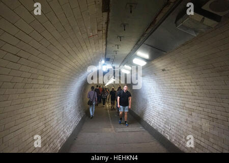 People walking through Greenwich foot tunnel under the River Thames, London, England Stock Photo