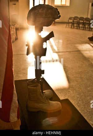 Old military combat boots with dog tags and two small American flags ...