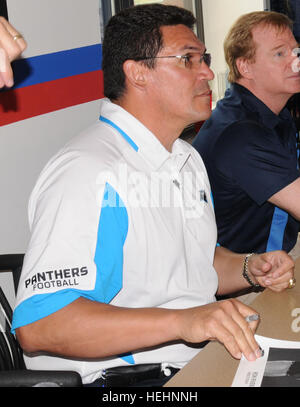 Photo by Reginald Rogers/Paraglide Carolina Panther head coach Ron Rivera, left, NFL Commissioner Roger Goodell and former Carolina Panthers player Mike Rucker sign autographs and photos for Soldiers at the 1st Brigade Combat Team dining facility Friday during their visit to the post. Ron Rivera (cropped) Stock Photo