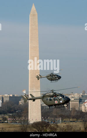 U.S. Soldiers with the 121st Medical Company fly their UH-72A Lakota helicopters in front of the Washington Monument during an orientation flight over Washington, D.C., March 6, 2009. The unit is the first medical evacuation unit to receive the new helicopters, which will eventually replace the UH-1 Iroquois fleet. (U.S. Army photo by Staff Sgt. Jon Soucy/Released) U.S. Soldiers fly their UH-72A Stock Photo