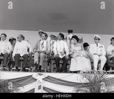 Seated during the Clark Air Force Base turnover ceremonies are from left to right, Foreign Minister of the Philippines, Carlos P. Romulo; Ambassador Richard W. Murphy; Philippine President and Mrs. Ferdinand Marcos; and Chairman of the Joint Chiefs of Staff, General David C. Jones. Marcos Clark Air Base 1979 Stock Photo