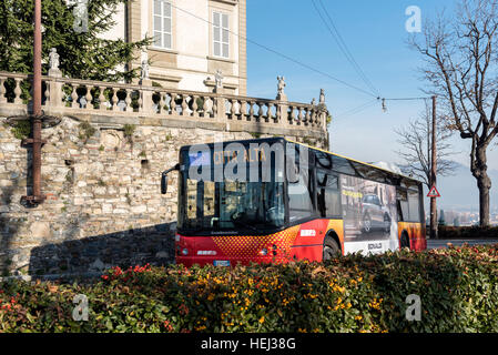 City bus is driving to Old Town Citta Alta of Bergamo town in Italy Stock Photo