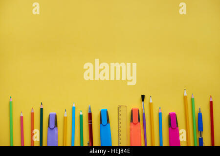 School supplies showing in a row Stock Photo