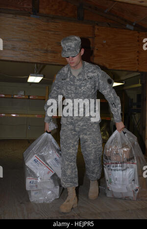 GUANTANAMO BAY, Cuba – Army Pfc. Robert Sherry, a Soldier with the 525th Military Police Battalion, Headquarters and Headquarters Company, Joint Task Force Guantanamo, collects mail from the post office to distribute to the rest of the battalion, Oct. 28, 2009. The 525th MP Battalion is stationed at JTF Guantanamo and provides much of the guard force that work inside the detention facilities. JTF Guantanamo conducts safe, humane, legal and transparent care and custody of detainees, including those convicted by military commission and those ordered released by a court. The JTF conducts intellig Stock Photo