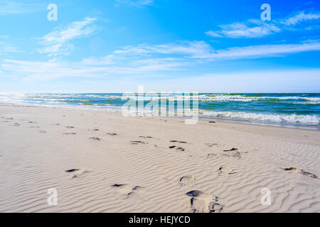 Footprints in white sand on a beach in Bialogora village, Baltic Sea, Poland Stock Photo