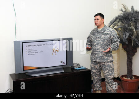 Sgt. Robert Burke, a mental health specialist and non-commissioned officer in charge of the 3rd Medical Command (Deployment Support) Behavioral Health Prevention Team, Pomona, Calif. native, gives a class to service members on the importance of good communication here Jan. 17. Third Army is dedicated to improving the mental and physical wellness of its troops. With dedicated organizations such as the 3rd MDSC BHPT in its ranks, Third Army is committed to motivating, educating, and helping servicemembers, the strength of our nation. 3rd MDSC Behavioral Health Prevention Team supports service me Stock Photo