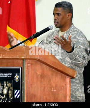 During a Black History Month ceremony, Col. Carlton Day, chief of National Guard Affairs, U.S. Forces-Iraq, talks at Camp Liberty Field House, Feb. 14, about the accomplishments of black Americans. Valentine's Day; celebrating Black history in a special way 100214-A--006 Stock Photo