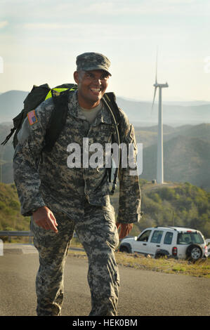 GUANTANAMO BAY, Cuba – Army Pfc. Terrance M. Robinson, deployed to Joint Task Force Guantanamo with the 525th Military Police Battalion, reaches the turnaround point atop of John Paul Jones Hill in the 14.4 mile try outs for the up-coming Bataan Memorial Death March, Feb. 20, 2009. The 525th MP Battalion provides a portion of the guard force inside the detention facilities at Joint Task Force Guantanamo. JTF Guantanamo conducts safe, humane, legal and transparent care and custody of detainees, including those convicted by military commission and those ordered released by a court. The JTF condu Stock Photo