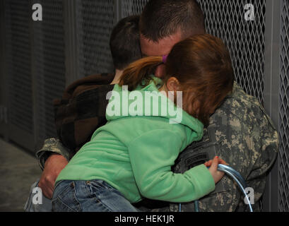 Saying goodbye is never easy, especially when it comes to children, Staff Sgt. Brian Rivers, a native of Mount Pleasant, Texas, holds is daughter Presley and son Maverick before he deploys to Afghanistan from Fort Drum, N.Y., March 28. Rivers is a food service specialist assigned to 1st Squadron, 71st Cavalry Regiment, 1st Brigade Combat Team, 10th Mountain Division. 1st Brigade Combat Team Prepare to Deploy 263989 Stock Photo