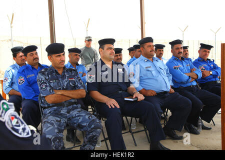 An Iraqi policemen from the Basra Criminal Evidence Division complete ...