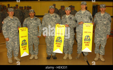 Psyops Soldiers leave for Afghanistan 100503-A-4429M-001 The 344th Tactical Psychological Operations (Psyops) Company (TPC), detachments 10, 7, and 6 display their Yellow Banners at Army Support Activity-Dix’s (ASA-Dix) Griffith Field House May 3. Accepting the banner for Det. 10 are San Antonio residents Maj. Hector Cuellar and 1st Sgt. Victor Moreno. Det. 7 is represented by Chief Warrant Officer 2 Paul Williams, from Belton, Texas, and Staff Sgt. John Ellison, from Temple, Texas. Capt. Matt Perritte, from Cedar Park, Texas, and Sgt. 1st Class Mark Williams, from Colorado Springs, Colo., rec Stock Photo