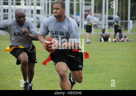 Staff Sgt. Jacob Hairston, with Headquarters and Headquarters Battery, 1st Battalion, 76th Field Artillery Regiment, 4th Infantry Brigade Combat Team, 3rd Infantry Division takes part in a flag football game, June 25, as part of the 3rd Inf. Div.’s Marne Week at Fort Stewart, Ga. Flickr - The U.S. Army - On the gridiron Stock Photo