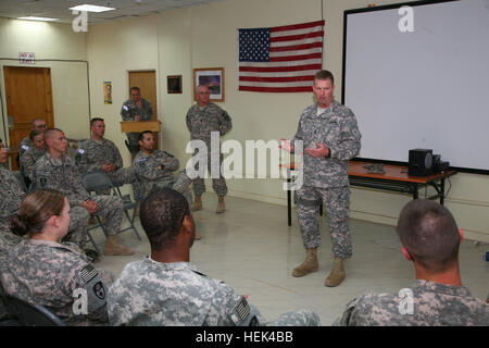 The command sergeant major of the US Army, Command Sgt. Maj. Kenneth O. Preston, talks to Soldiers from the California National Guard's 49th Military Police Brigade during a brief visit to Camp Liberty, Iraq, June 26. After addressing the room full of Soldiers, Preston, the senior enlisted advisor to the Chief of Staff of the United States Army, gave service members an opportunity to ask questions during this special occasion. Command sergeant major Visits Camp Liberty 295024 Stock Photo