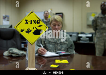 U.S. Army Gen. Ann Dunwoody, Commander of Army Materiel Command, receives brief in Joint Robotic Repair Facility in Camp Victory, Iraq, Sept. 27, 2010. Dunwoody visited United States Forces - Iraq to engage senior leaders and share capabilities of the Middle East. (U.S. Photo by Spc. Jason A. Young/Released) Operation New Dawn 324837 Stock Photo