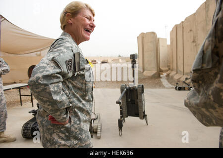 U.S. Army Gen. Ann Dunwoody, Commander of Army Materiel Command, receives a demonstration at Joint Robotic Repair Facility in Camp Victory, Iraq, September 27, 2010. Dunwoody visited United States Forces - Iraq to engage senior leaders and share capabilities of the Middle East. Operation New Dawn 324842 Stock Photo