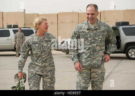 U.S. Army Gen. Ann Dunwoody, Commander of Army Materiel Command , meets with U.S. Army Brig. Gen. Gustave Perna, logistics director, with United States Forces - Iraq J4 in Camp Victory, Iraq, Sept. 27, 2010. Dunwoody visited United States Forces - Iraq to engage senior leaders and share capabilities of the Middle East. Operation New Dawn 324840 Stock Photo