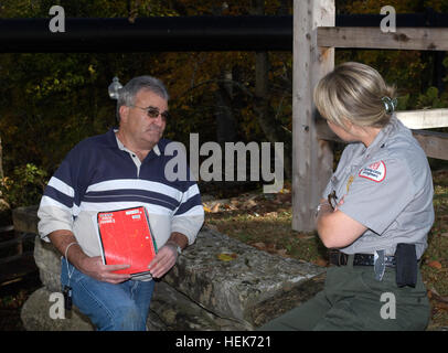 Park Ranger Judy Daulton speaks with a visitor Oct. 27, 2010 at Mill Springs Mill, which is a historical gristmill from the 1800s that is preserved and administered by the U.S. Army Corps of Engineers Nashville District.  The mill is located off Kentucky Highway 90 between Burnside and Monticello on the banks of scenic Lake Cumberland in Mill Springs, Ky.  (USACE photo by Lee Roberts) Public get historic treat at Corps gristmill 338174 Stock Photo