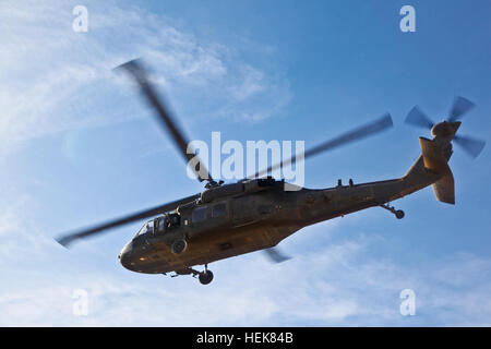 A UH-60 Black Hawk helicopter takes off near the Deh Yak District Center, Dec. 14. The helicopter was transporting coalition leaders to conduct a meeting with the local district leaders. (U.S. Army photo by Sgt. Justin Howe) Soldiers continue work in Deh Yak 351283 Stock Photo