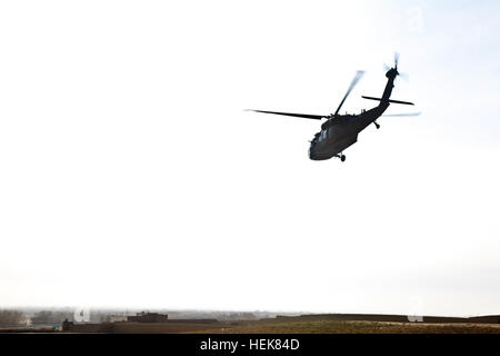 A UH-60 Black Hawk helicopter takes off near the Deh Yak District Center, Dec. 14. The helicopter was transporting coalition leaders to conduct a meeting with the local district leaders. (U.S. Army photo by Sgt. Justin Howe/Released) Soldiers continue work in Deh Yak 351275 Stock Photo