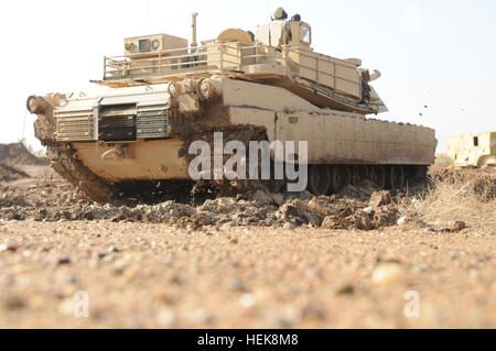 An Iraqi Army Tanker With The 9th Armored Division Drives An M1A1 ...