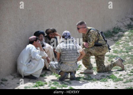 U.S. Army personnel from Task Force Wings meet with school officials near FOB Wolverine, Zabul province, Afghanistan, supporting education for 300 local children and collaborating on school development projects. Stock Photo