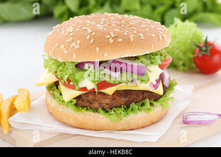 Cheeseburger hamburger beef onion tomatoes lettuce cheese unhealthy Stock Photo