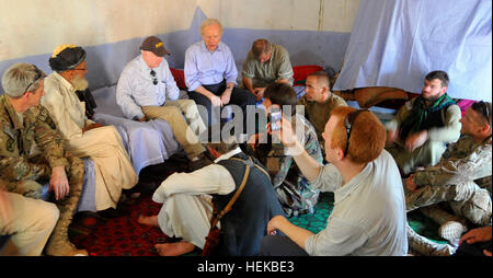 KONAR PROVINCE, Afghanistan – A Mangwel village elder and Senators John McCain, Joe Lieberman and Lindsey Graham discuss Afghan Local Police and Village Stability Operations in Mangwel village, Khas Kunar district, Konar province, July 4. The senators visited the village to discuss current and future plans for ALP and VSO. (U.S. Army photo by Sgt. Lizette Hart, 19th Public Affairs Detachment) Senators visit special operations forces soldiers in eastern Afghanistan 423810 Stock Photo