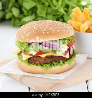 Cheeseburger hamburger and fries beef tomatoes lettuce cheese unhealthy Stock Photo