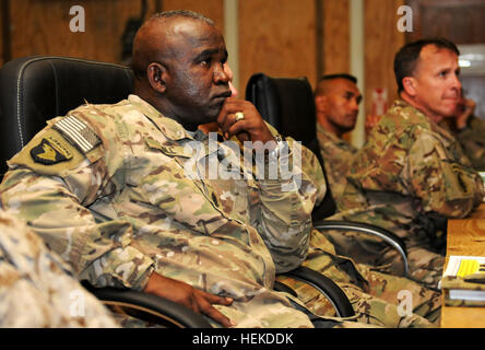 In this photo provided by ISAF Regional Command South, Army Command Sgt. Maj. Marvin L. Hill, ISAF command sergeant major, listens to briefings at the monthly ISAF Command Sergeant Major Conference at Kandahar Airfield Sept. 10. The focus of this conference was how to maximize safety, manpower and efficiency among the units in RC-S, particularly the utilization of enablers- tools and robotics that help service members identify improvised explosive devices before they can detonate. CSM Hill at the CSM Conference 454588 Stock Photo