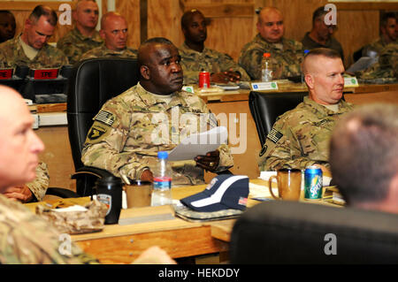 In this photo provided by ISAF Regional Command South, Army Command Sgt. Maj. Marvin L. Hill, ISAF command sergeant major, listens to briefings at the monthly ISAF Command Sergeant Major Conference at Kandahar Airfield, Sept. 10. The focus of this conference was how to maximize safety, manpower and efficiency among the units in RC-S, particularly the utilization of enablers- tools and robotics that help service members identify improvised explosive devices before they can detonate. CSM Hill at the CSM Conference 454591 Stock Photo