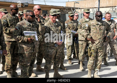 In this photo provided by ISAF Regional Command South, Army Command Sgt. Maj. Marvin L. Hill, ISAF command sergeant major, listens to a description of equipment at the monthly ISAF Command Sergeant Major Conference at Kandahar Airfield Sept. 10, 2011. The focus of this conference was how to maximize safety, manpower and efficiency among the units in RC-S, particularly the utilization of enablers- tools and robotics that help service members identify improvised explosive devices before they can detonate. A series of static displays was set up by soldiers who work with the enablers on a regular  Stock Photo