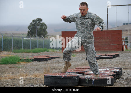 Sgt. Ryan Williams of Yucaipa, Calif., a military police officer with the 40th Military Police Company, 49th Military Police Brigade, races to the end of a lengthy obstacle course during the Best Warrior Competition at Camp San Luis Obispo, Calif., Sept. 15. The obstacle course was one of the events Williams felt strongly about, stating earlier in the week, “I’m looking forward to the obstacle course tomorrow, I think I’ll do really well on that.” California National Guard soldiers compete to become the 2011 Best Warrior 110915-A-XQ016-025 Stock Photo