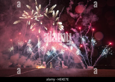 Brighton, UK. 21st December, 2016.  Thousand of spectators gathered to watch The Burning the Clocks on Brighton Beach, Thousands of clocks are loaded onto the boat on the beach then set on fire and a with firework finale to mark the winter solstice, England.© Jason Richardson / Alamy Live News Stock Photo