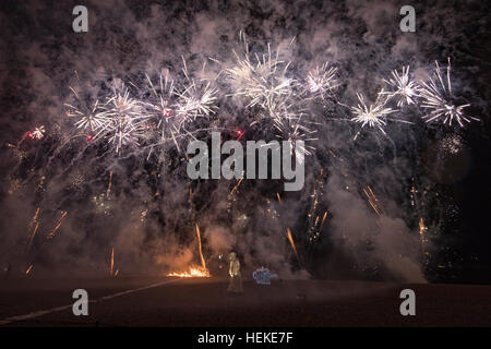 Brighton, UK. 21st December, 2016.  Thousand of spectators gathered to watch The Burning the Clocks on Brighton Beach, Thousands of clocks are loaded onto the boat on the beach then set on fire and a with firework finale to mark the winter solstice, England.© Jason Richardson / Alamy Live News Stock Photo