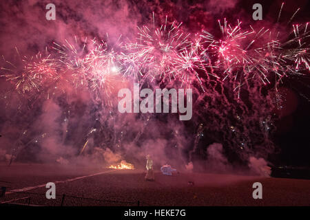 Brighton, UK. 21st December, 2016.  Thousand of spectators gathered to watch The Burning the Clocks on Brighton Beach, Thousands of clocks are loaded onto the boat on the beach then set on fire and a with firework finale to mark the winter solstice, England.© Jason Richardson / Alamy Live News Stock Photo