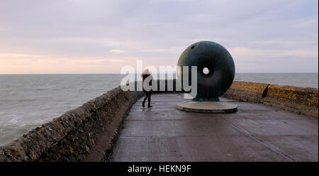Brighton Sussex UK 23rd December 2016 - Visitors enjoy a bracing walk on Brighton seafront as Storm Barbara is expected to hit Britain later today with winds forecast to reach up to 90 mph in Scotland  Photograph taken by Simon Dack Credit: Simon Dack/Alamy Live News Stock Photo