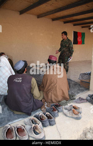 Afghan Local Police candidates receive first aid training from Afghan National Army Special Forces in Kajran, Daukundi province, Afghanistan, Nov. 23, 2011. The ALP are being trained to become well rounded patrolmen to help maintain security in the surrounding area. ALP academy 111123-A-NC985-004 Stock Photo