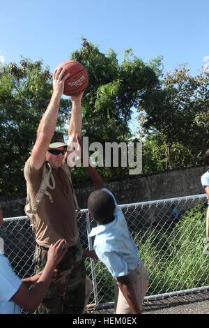 Navy Seabees from Mobile Construction Battalion 23 conduct community engagement at Rafaela Santaella Basic School in Santo Domingo, Dominican Republic, on November 16, 2011, including recreational activities and infrastructure improvements under SPS 2012. Stock Photo