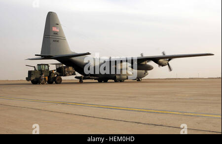 A pallet of luggage is loaded onto a C-130 aircraft at Ali Air Base just before take off on Contingency Operating Base Adder Nov. 18. Leaving on a jet plane, Air Force welcomes service members to the flightline home 111118-A-IX584-179 Stock Photo