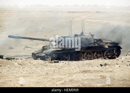 An Iraqi T-55 main battle tank damaged during Operation Desert Storm. Damaged Iraqi T-55 near Kuwaiti border Stock Photo