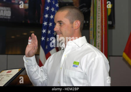 Casey Mears, driver of the National Guard's NASCAR car, takes an oath of allegiance at the Army National Guard Readiness Center in Arlington, Va., Jan. 12, 2007. Mears will drive the new number 25 National Guard GMAC Chevy Monte Carlo SS in the NASCAR Nextel Cup series. (U.S. Army photo by Sgt. Jim Greenhill) (Released) Casey Mears 2007 Stock Photo