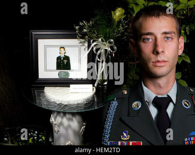 U.S. Army Sgt. Colton Hurley, an infantry team leader with the 82nd Airborne Division's 1st Brigade Combat Team, stands next to a memorial for his mother, Sgt. Krystal Hurley, in this undated photograph.  Hurley was inspired to serve 20 years in the Army by his mother, a combat medic who passed away when he was an infant. Why we serve, Sgt. Colton Hurley 100701-A-DK678-756 Stock Photo