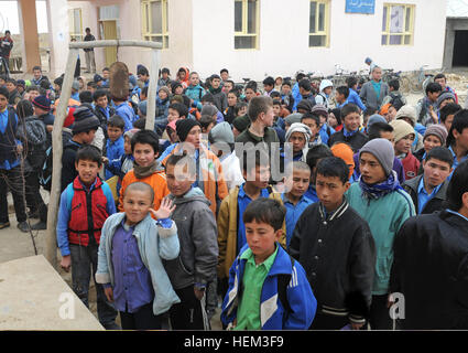 Young Afghan boys stand outside of the Aliabad School near Mazar-e-Sharif, Afghanistan, March 10, 2012. Their new school, a project started by the 1st Brigade, 10th Mountain Division, and continued by the 170th and 37th Infantry Brigade Combat Teams, is being built next to the current school and will accommodate the current volume of students with additional room for the town's growing population. Young Afghan boys stand outside of the Aliabad School near Mazar-e-Sharif, Balkh province, Afghanistan, March 10, 2012 120310-A-LE308-006 Stock Photo