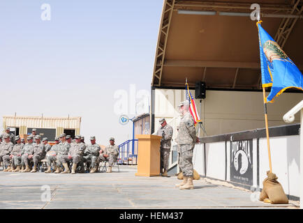 The Commander of the 1st Battalion, 160th Field Artillery Lt. Col. Jimmy Thomas gives his final remarks his troops as they transfer authority to the Mississippi National Guard’s 112th Military Police Battalion during the Mar. 26 ceremony at Camp Buehring, Kuwait. The 1-160th FA was deployed to Kuwait in support of Operation New Dawn. 1-160th FA transfers authority to the 112th MP 120326-A-NN234-099 Stock Photo