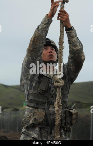 120425-Z-PP889-003 Sgt. Robert McFatridge, a cannon crewmember with Hawaii Army National Guard’s Alpha Battery, 1st Battalion, 487th Field Artillery, sizes up the task of climbing up a 20-foot long rope during the obstacle course event in the 2012 Region VII Best Warrior Competition at Camp San Luis Obispo, Calif., April 25. Scaling the rope was the second to last task McFatridge had to complete in the obstacle course, this after pulling a dummy through a wet sandpit, maneuvering through a 10-foot high cross weave platform, and several other challenges to test competitors on all levels. (Army  Stock Photo