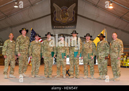 82nd Combat Aviation Brigade leadership poses with medal recipients on Forward Operating Base Fenty, Afghanistan, April 26.  Pictured from left to right: 82nd Combat Aviation Brigade Command Sgt. Maj. Larry Farmer, of San Diego, Calif.; 1st Sgt. Daniel Moesch, of Ithaca, N.Y.; Chief Warrant Officer 2 Clifford Shaw, of Melbourne, Fla.; Chief Warrant Officer 2 Jason Smith, of Little Falls, N.Y.; Chief Warrant Officer 3 David Briggs, of Toledo, Wash.; Chief Warrant Officer 2 Bradley Greer, of Birmingham, Ala.; Chief Warrant Officer 3 Michael Eckhardt; Lt. Col. Jeffrey Cheeks, Task Force Saber com Stock Photo