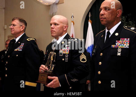 California's state Command Sgt. Maj. William Clark and Camp Roberts post commander, Brig. Gen. Keith Jones, who was representing The Adjutant General, Maj. Gen. David S. Baldwin, stand next to Staff Sgt. Eugene Patton, an intelligence analyst with Colorado Army National Guard 117th Space Battalion, who won NCO of the Year for the 2012 ARNG Region VII Best Warrior Competition at Camp San Luis Obispo, Calif., April 26. The best warriors in Region VII clash to earn the right to compete at Nationals 120426-A-PP889-709 Stock Photo