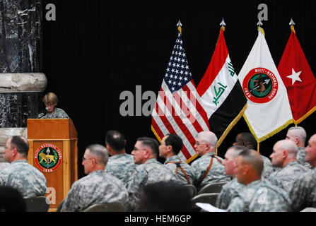 Brig. Gen. Mary Legere, director for intelligence, Multi-National Force - Iraq, uses slides to teach service members and civilians about significant female environmentalists throughout history at Al Faw Palace, March 30, during a Women's History Month ceremony centering on 'women taking the lead to save our planet.' Legere was the keynote speaker for the ceremony. Multi-National Corps - Iraq Women's History Month ceremony 161624 Stock Photo