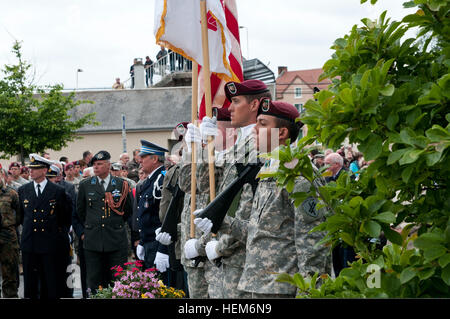 Task Force 68, which is made up of paratroopers from U.S., Germany, France, Holland, and United Kingdom, marched down the streets of Carentan, France after a memorial ceremony honoring the soldiers of D-Day. Task Force 68 is in Normandy, France to commemorate the 68th anniversary of D-Day. U.S. Soldiers take part in the 68th anniversary of D-Day in Normandy, France, June 3, 2012 120603-A-GI910-856 Stock Photo